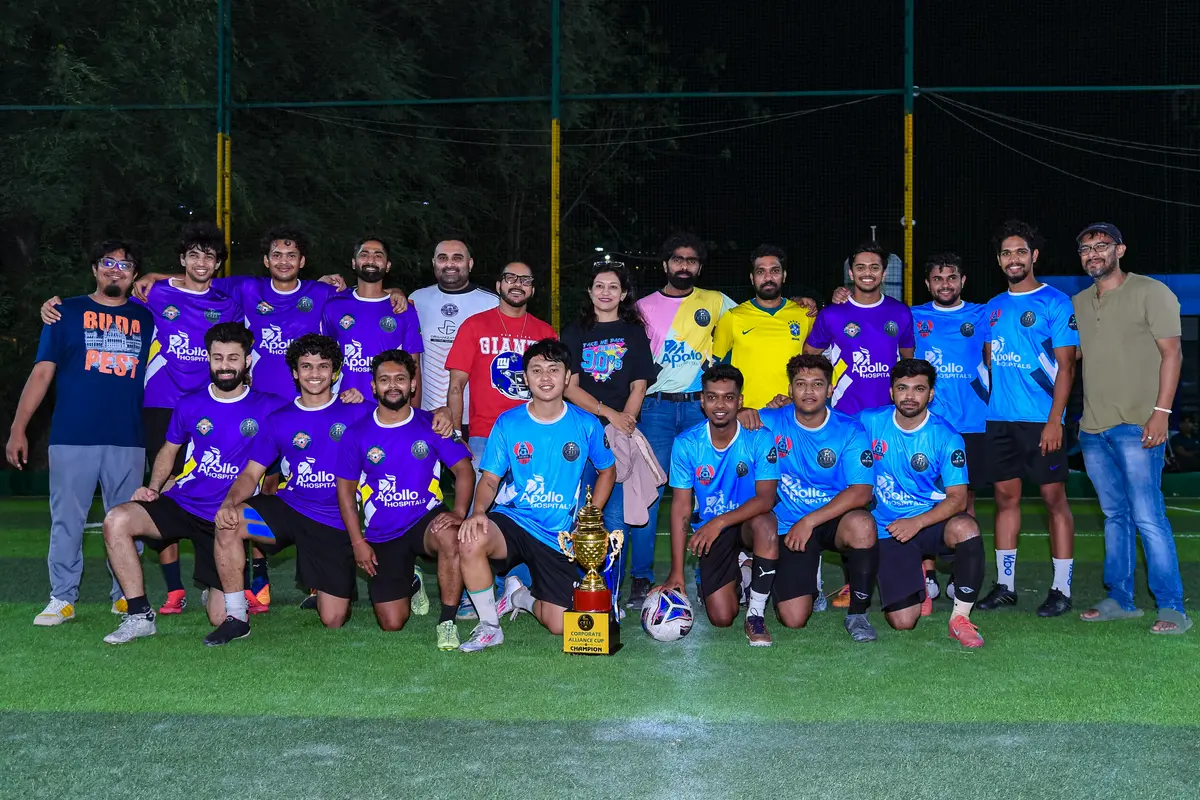 A team group photo with the trophy at Corporate Alliance Cup 2026